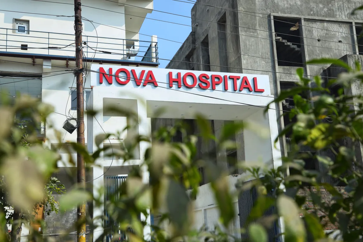 Exterior View of the entrance of Nova Hospital, showcasing a modern multi-speciality building with clean architecture,clear signage, and a welcoming entrance, representing advanced healthcare services and patient care excellence